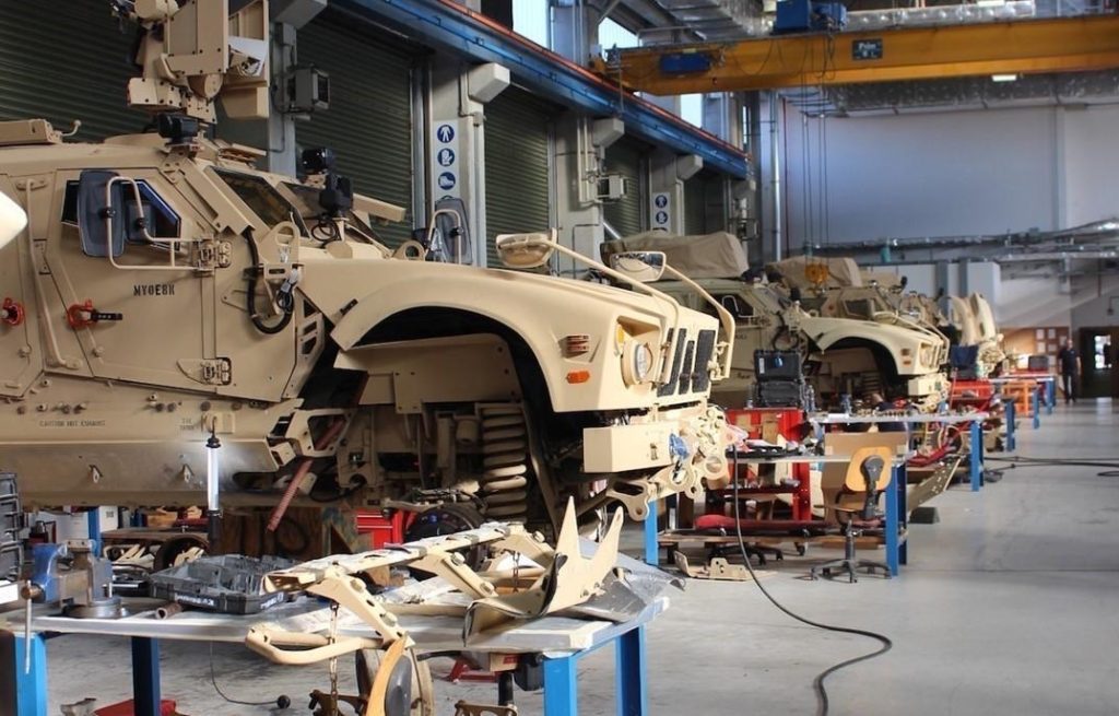Military procurement specialists reviewing supplier qualifications, quality assurance documentation, traceability records, and NATO compliance requirements for defense procurement